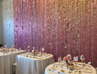 Decorated party room with fluorescent balloons and glowing party favors.
