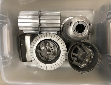Metal parts in a sculptor's workshop bin, image 14.