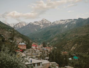 a mountain view of a town with a mountain in the background