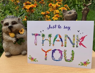 A greeting card with the words Just to say Thank You printed in tropical exotic word art