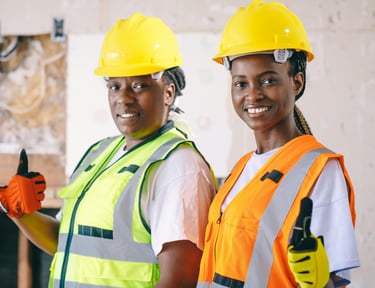 Happy service business workers on a jobs site Photo by Kindel Media