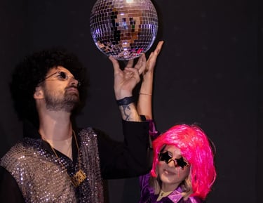 Tourists holding a disco ball in a neon-lit party room, a unique things to do in Split nightlife.