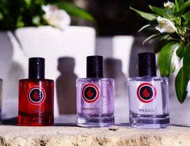 a group of bottles of envoke's perfumes and fragrances