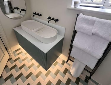 a bathroom with a bathtub and a mirror a bathroom with a shower and a toilet fitted by pbp services