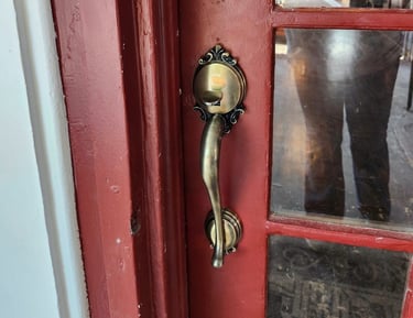 Red antique door with gold locks representing residential and commercial trusted Jack’s locksmith services