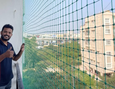 A happy family enjoying their pigeon-free apartment balcony after installation.