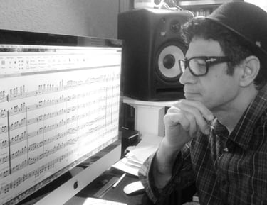 Maestro Bobby Ramirez composing and arranging music 