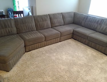 Freshly cleaned sectional sofa upholstery by Grossbusters