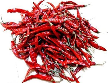Bright red Teja dried chillies stacked together.