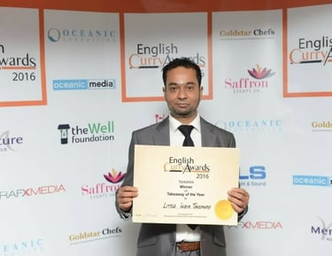 Amrad receiving winning curry award in 2016
