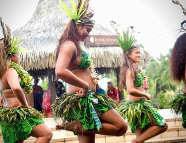 Tahitians dressed in traditional attire during a local dance in Tahiti, French Polynesia.