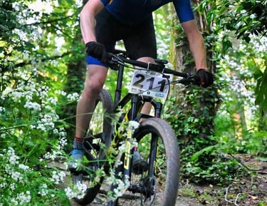 a man riding a bike on a trail