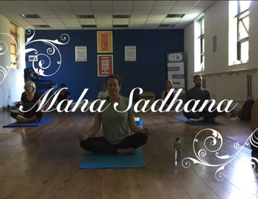 a group of people sitting meditating on yoga mats