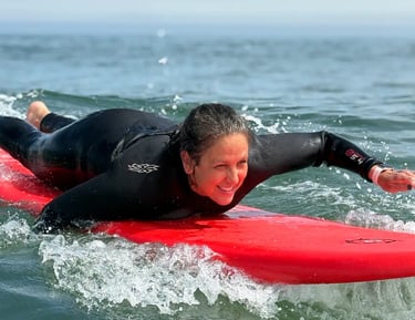 woman from montreal paddling into a wave