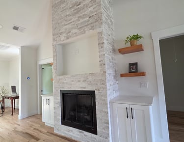 Fireplace construction and remodeling with expert stonework, modern finishes, and built-in features