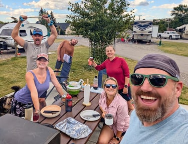 Friends enjoying dinner at Waterton Lakes Campground in Waterton Lakes National Park.