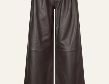 High-waisted dark brown faux leather wide-leg trousers with pleated front detailing.
