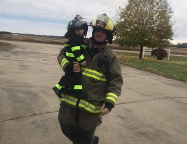 This is an image of the owner of AG's General Contractor and his child.