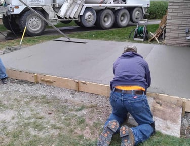 AG's General Contractor finishing up a concrete slab for a customer