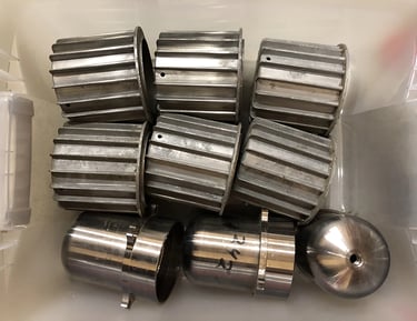 Metal parts in a sculptor's workshop bin, image 7.