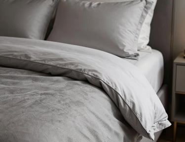 A cozy, well-organized bedroom with harmonious colors and clutter-free surfaces.