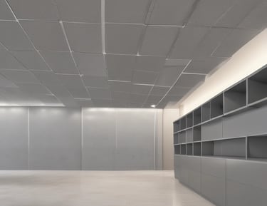 Commercial space under renovation with workers installing new materials.