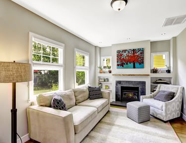 a living room with a couch and a chair