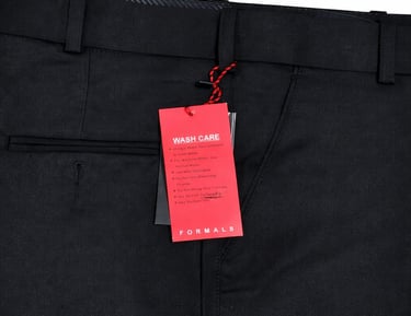 a black suit with a red tag  on it