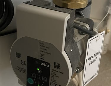 A Wilo central heating circulation pump installed on an unvented hot water cylinder..