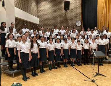 Children's choir smiling after a performance