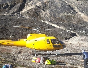 a helicopter landing at Yellow Valley Base camp Carstensz Pyramid