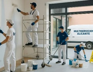 Pintores en un local de Alicante con la furgoneta y logo aparcada en la calle