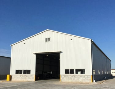 A sleek commercial building representing real estate services for businesses.