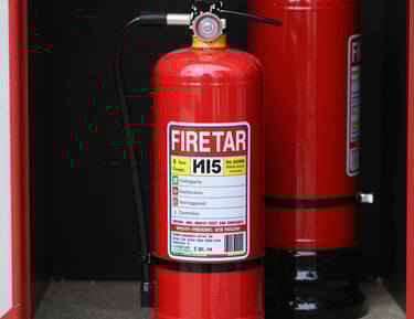 Fire protection equipment, such as extinguishers and alarms, installed in a commercial building.