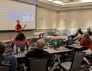 Kassandra speaking at a conference about attachment styles