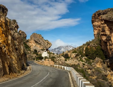 The gorge known as "Cortao de las Peñas" with the snow-capped Sierra de la Pila mountain range in th