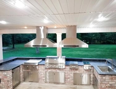 a kitchen with a grill and a grill