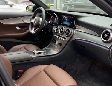 Close-up of premium detailing products and tools arranged neatly on a clean surface.