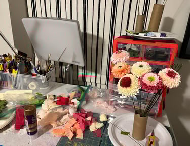 a view of part of the artist's paper flower studio