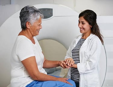 Doctor consulting senior patient after MRI scan at Delhi facility.