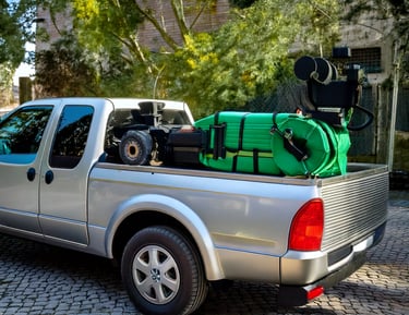 a truck with a large amount of green hoses on it