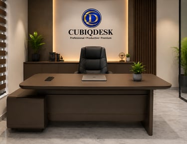 Modern executive office interior featuring a brown Cubiqdesk desk with a black leather chair and green plants.