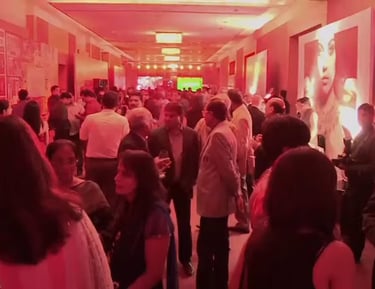 a group of people standing in a hallway with red hue