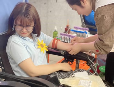 a girl is donating blood