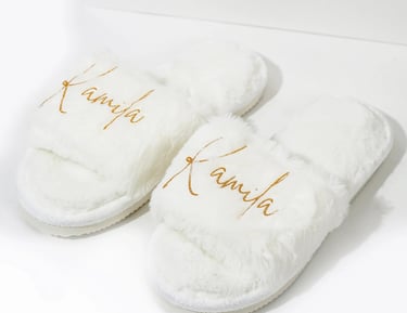 a pair of slippers with the words,'kanra'written on them