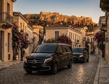 Luxury private Athens transfers: Two polished black Mercedes-Benz V-Class minivans in Plaka near Acropolis - Athens GO