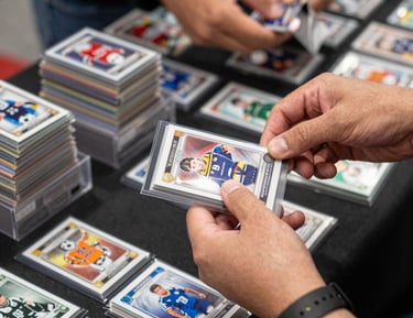 Close-up of rare soccer cards displayed on a collector’s table.