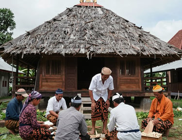 A group photo of Praja Riau members during a social event in traditional attire.