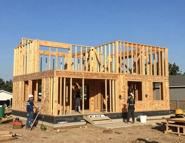 A freshly built modern home with clean lines and large windows.