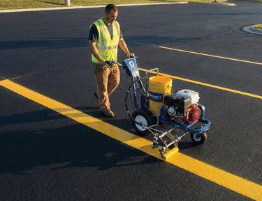 Person striping parking spots